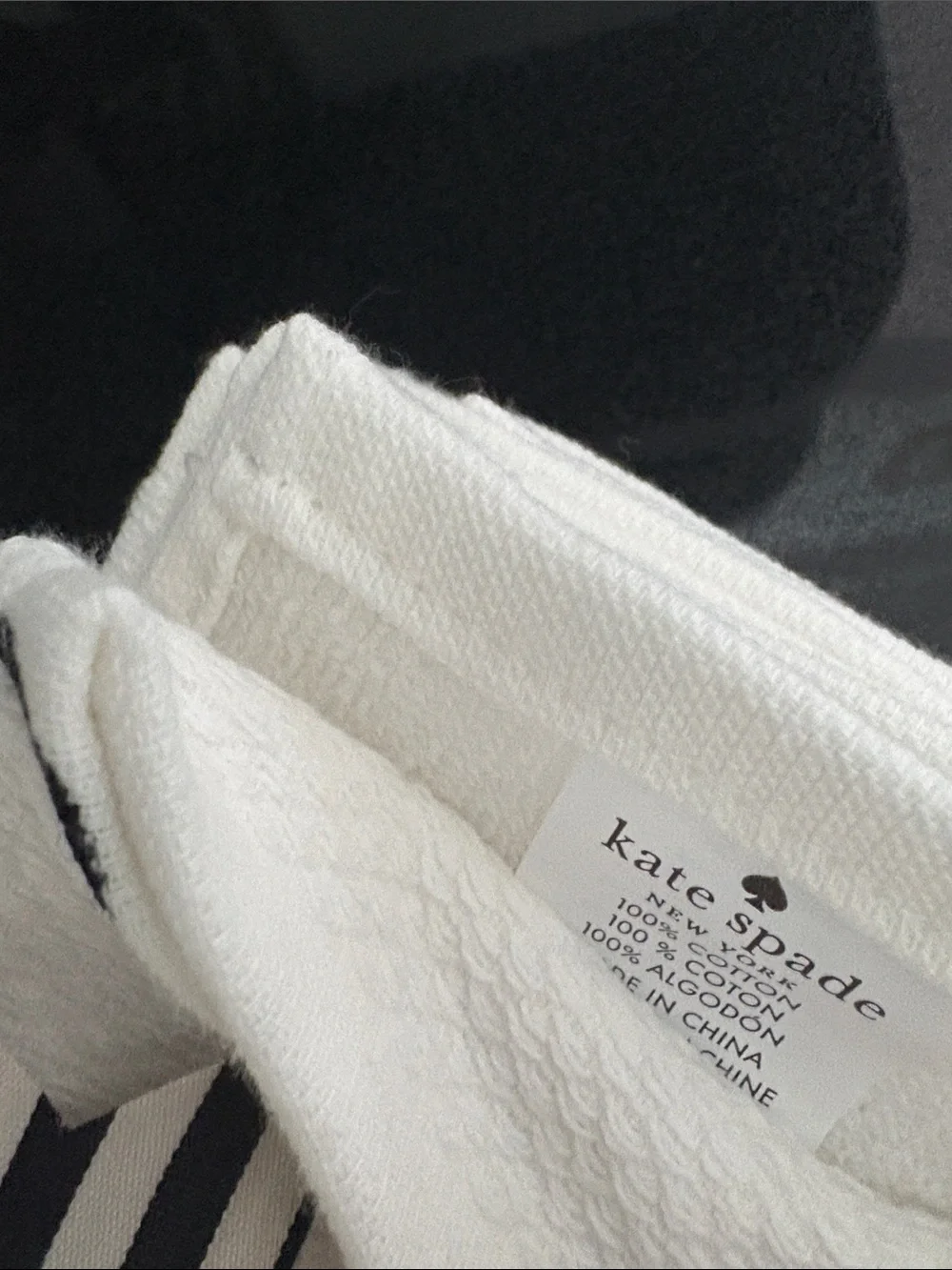 KATE SPADE Three black & white polka dot kitchen towels.